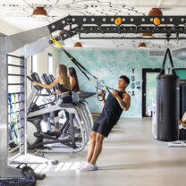 Residents working out in the fitness center